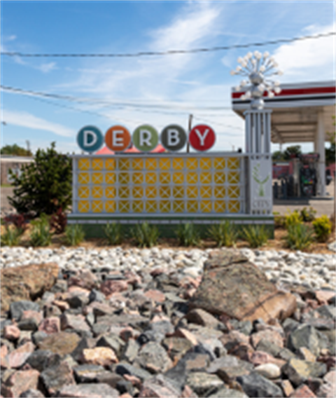 Monument sign for Derby at the corner of 72nd and Hwy 2