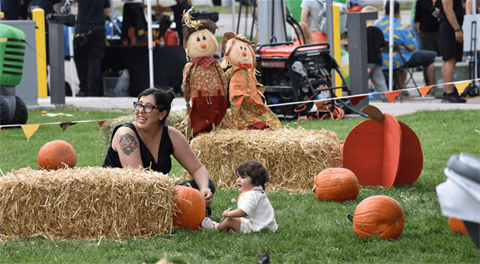a mother and child enjoying the pumpkin patch at Fall Fest