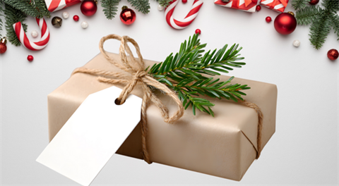 Present wrapped in brown paper with a tag, rope twine. On a holiday background. 