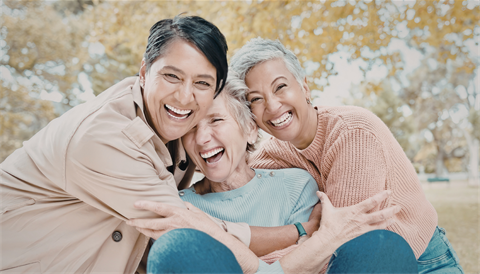 Three women smiling. 