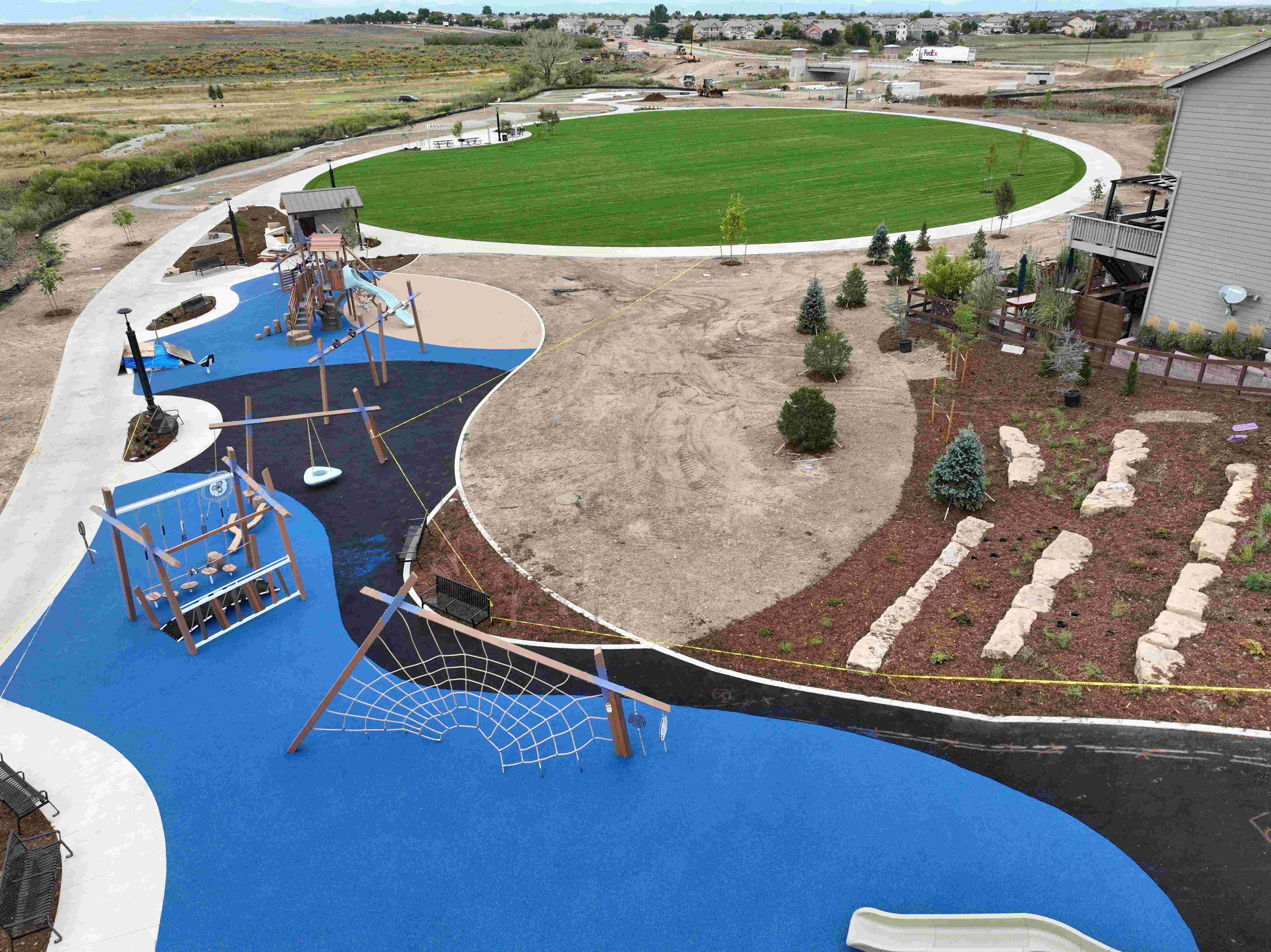 Drone shot of playground and grass field. 