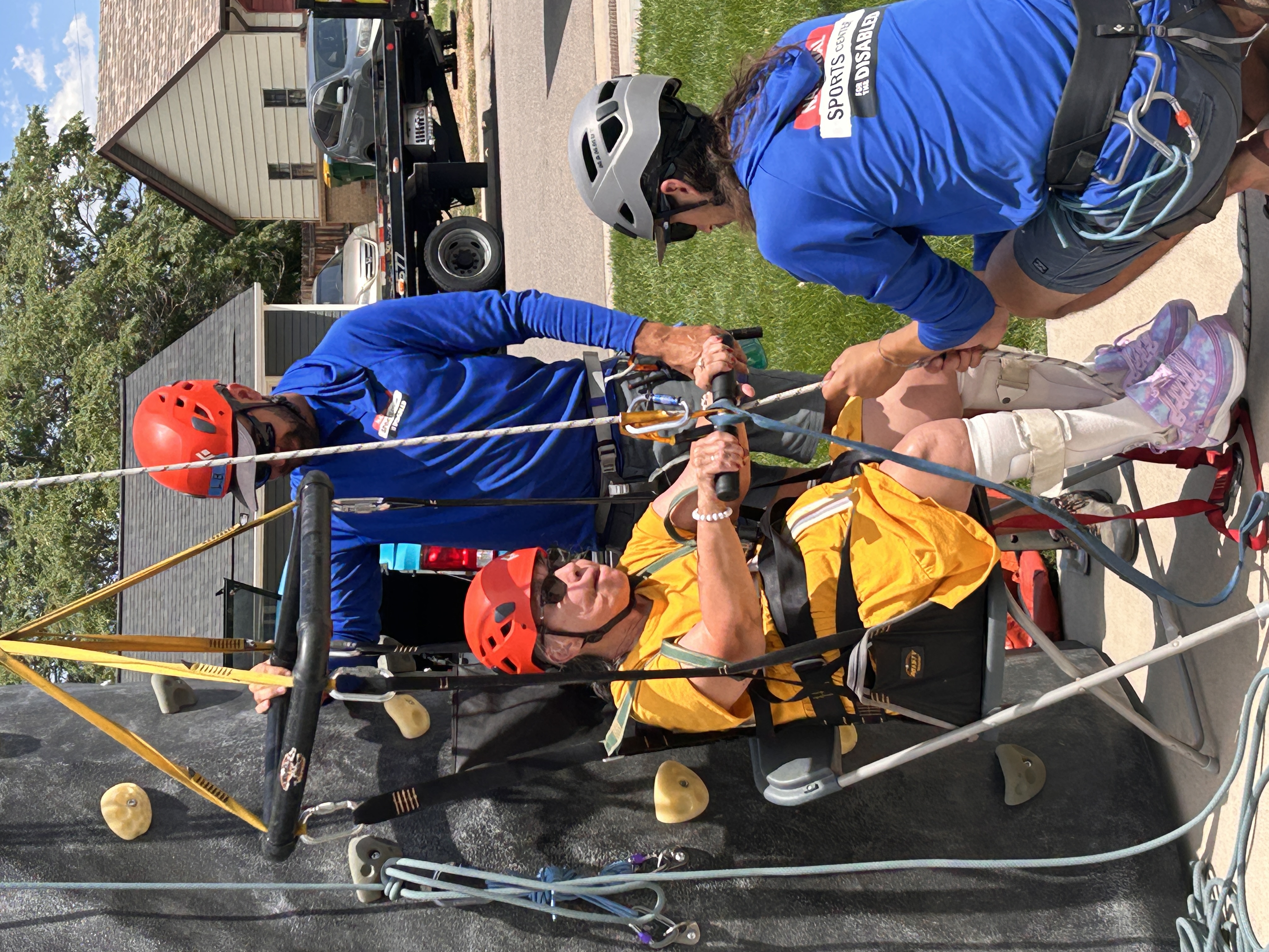 Woman learning adaptive climbing 