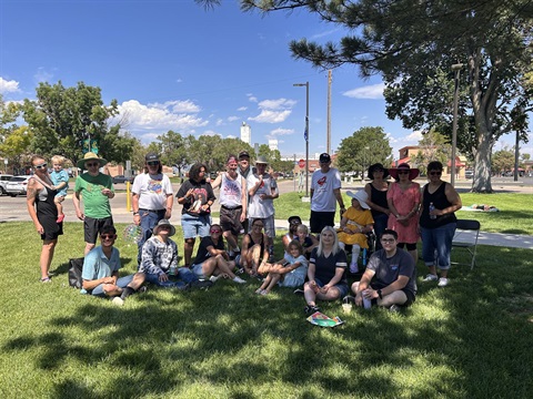 Group picture of people under a tree