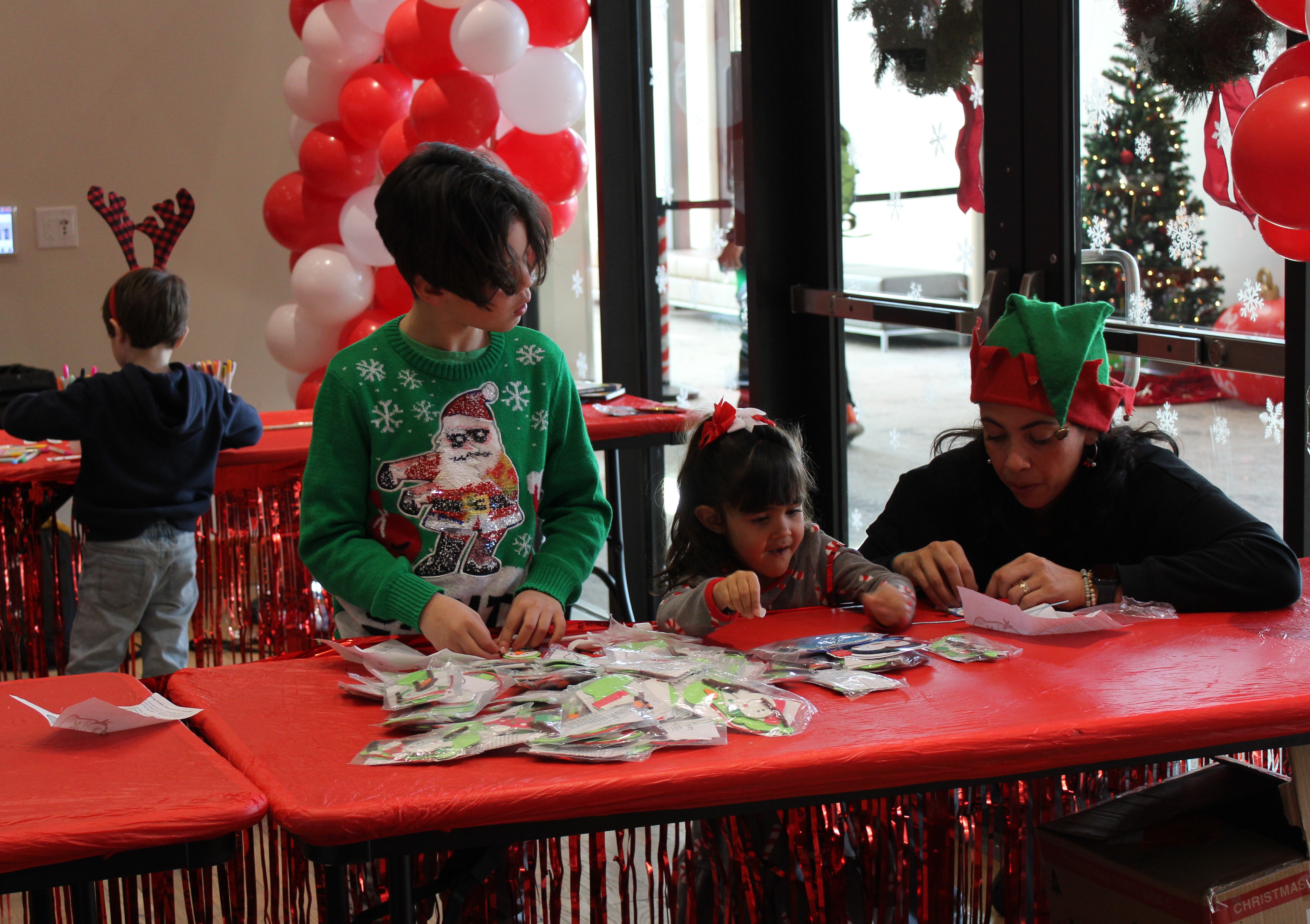 Family at holiday craft table